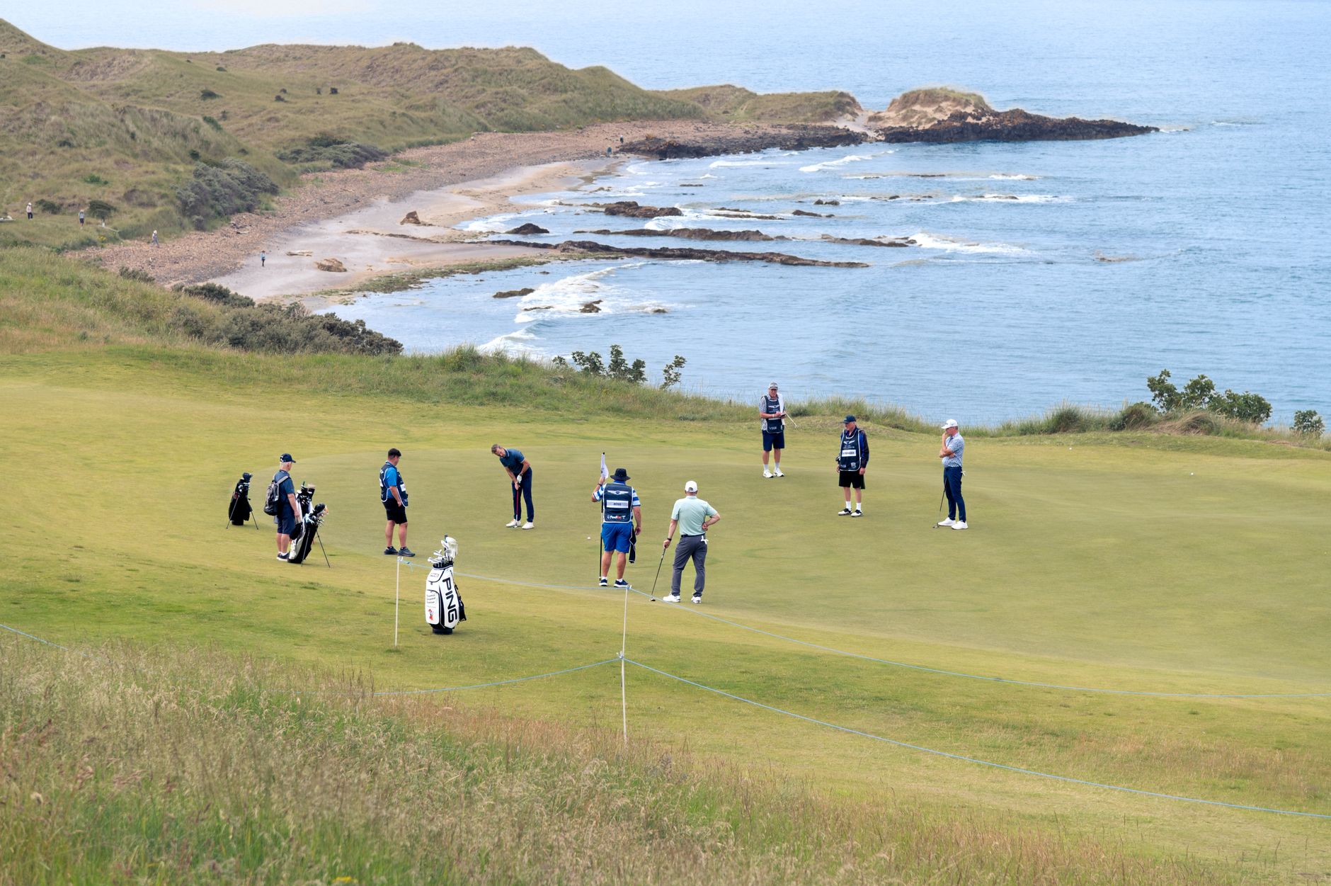 Golfers enjoy a game on a coastal course with stunning ocean views. — photograph by Becky L on Pexels