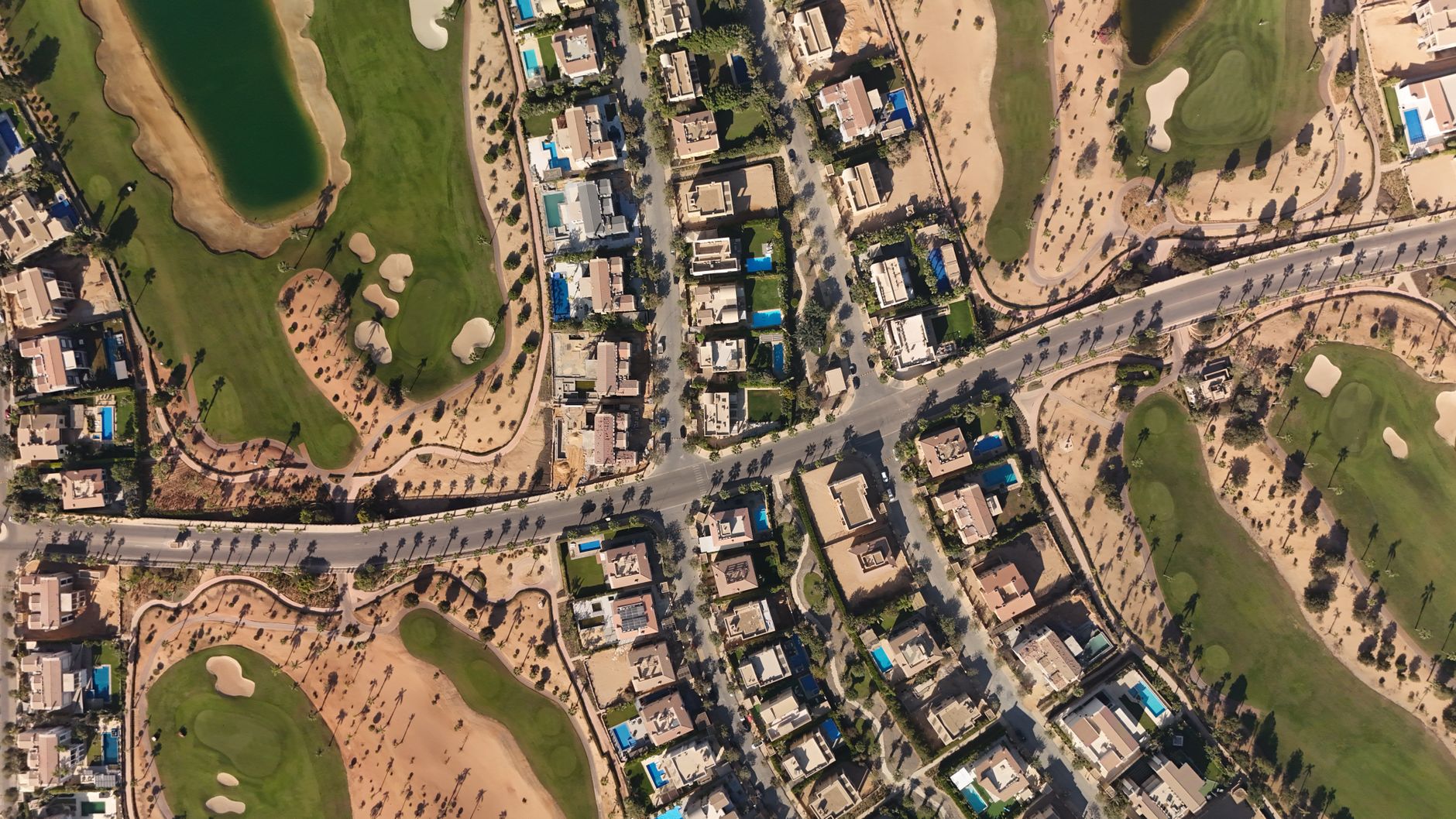 Discover the luxury homes and green golf courses in Sheikh Zayed, Egypt, captured from above. — photograph by Ahmed Bahaa on Pexels