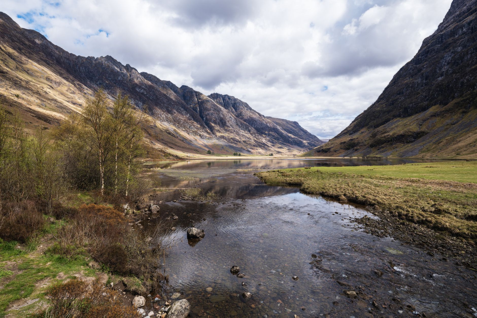 Beautiful view of Glencoe Valley with mountains and calm river in the Scottish Highlands. — photograph by Rino Adamo on Pexels
